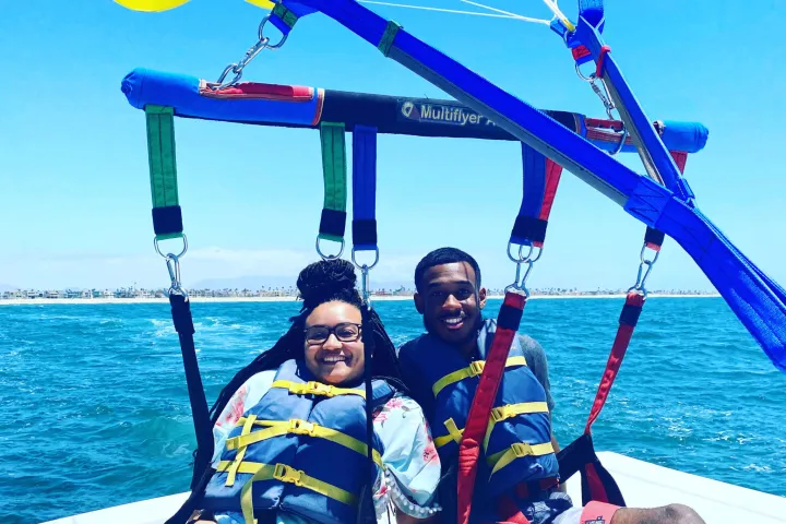 a person riding on the back of a boat